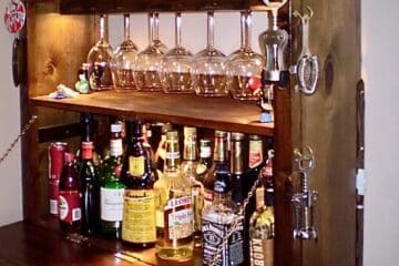 IKEA IVAR modified into a home bar cabinet with drop leaf table, stemware holder at the top and enclosed side panels