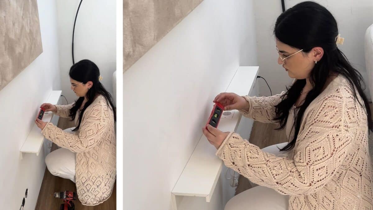 behind couch table with outlet DIY - use spirit level to check