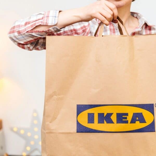 woman with ikea store paper bag, ikea shopping