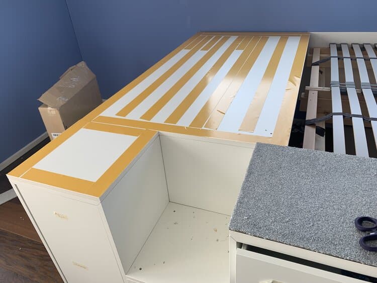 carpet squares on top of platform bed