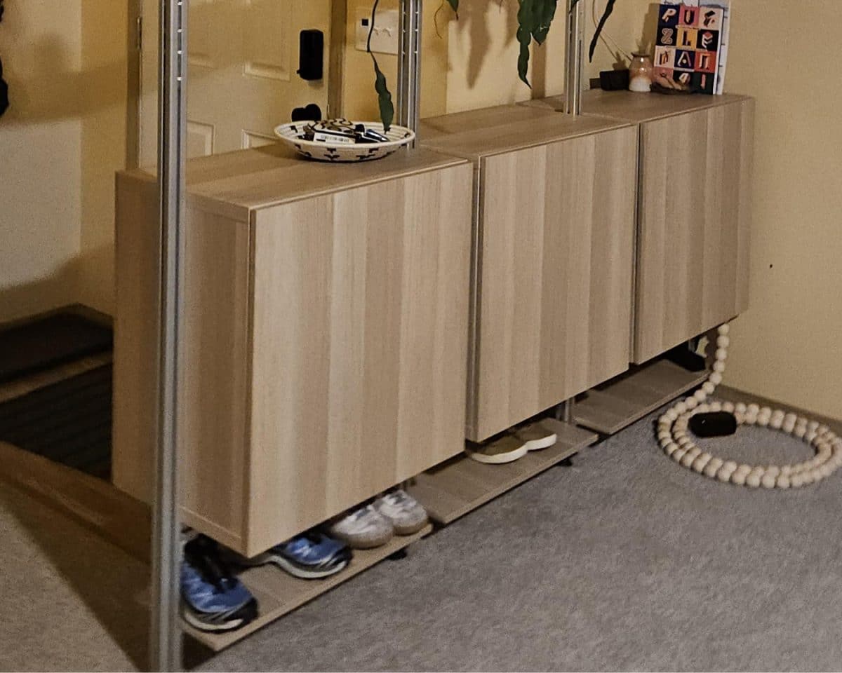 BESTÅ cabinets joined and suspended on poles