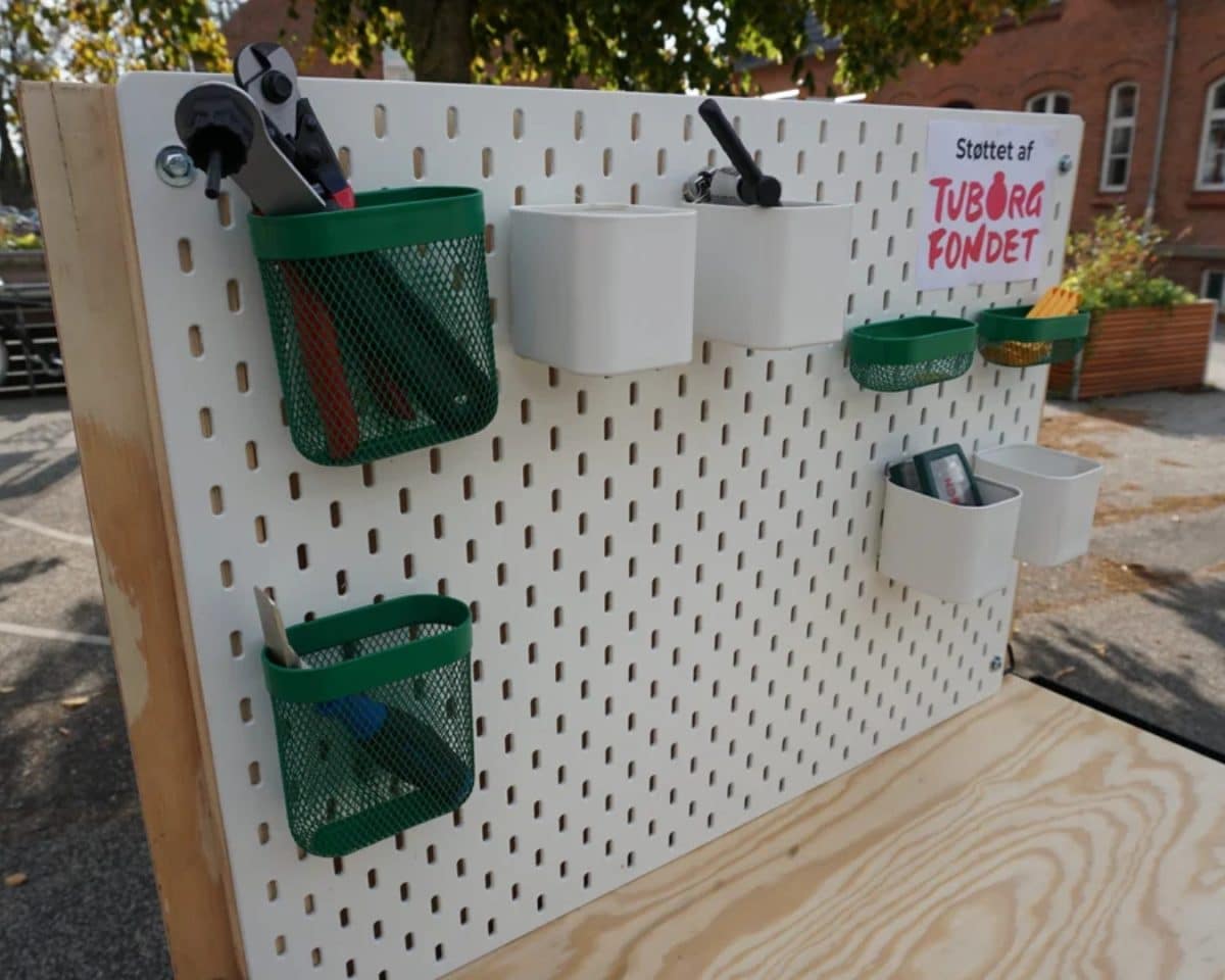 SKÅDIS pegboard attached to BROR cabinet and installed on bike trailer