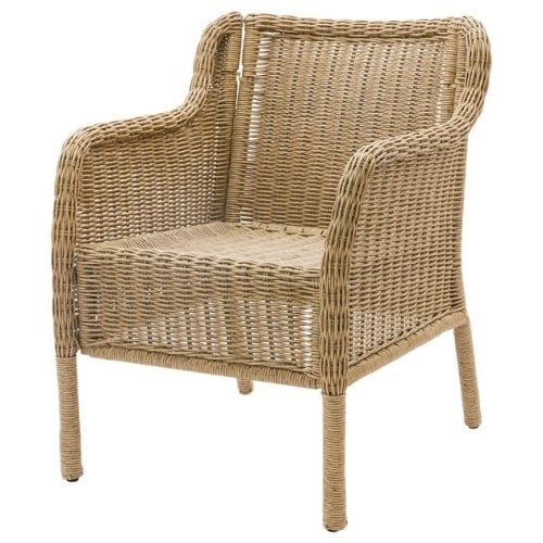 Woven wicker armchair with curved arms and four legs.