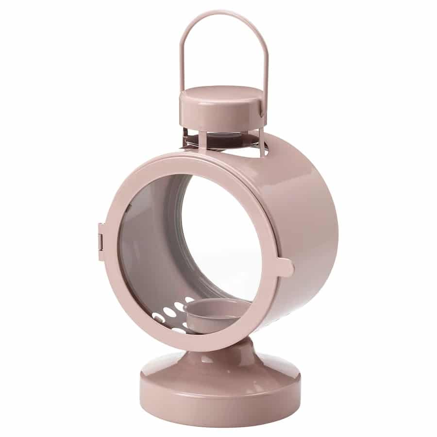 Pink round pet grooming chamber on a pedestal with a transparent front door.