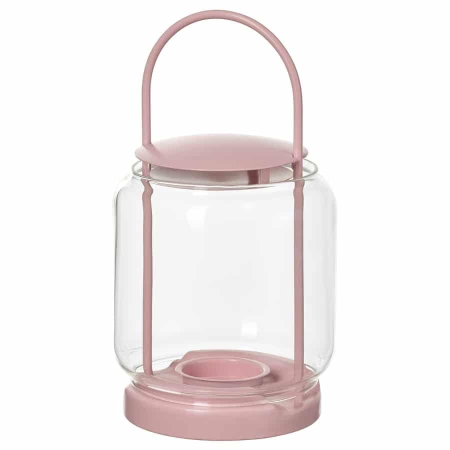Pink glass lantern with a rounded pink handle and circular pink base, empty interior.”