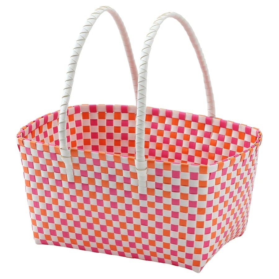 Basket tote with pink and orange checker pattern and white braided handles.