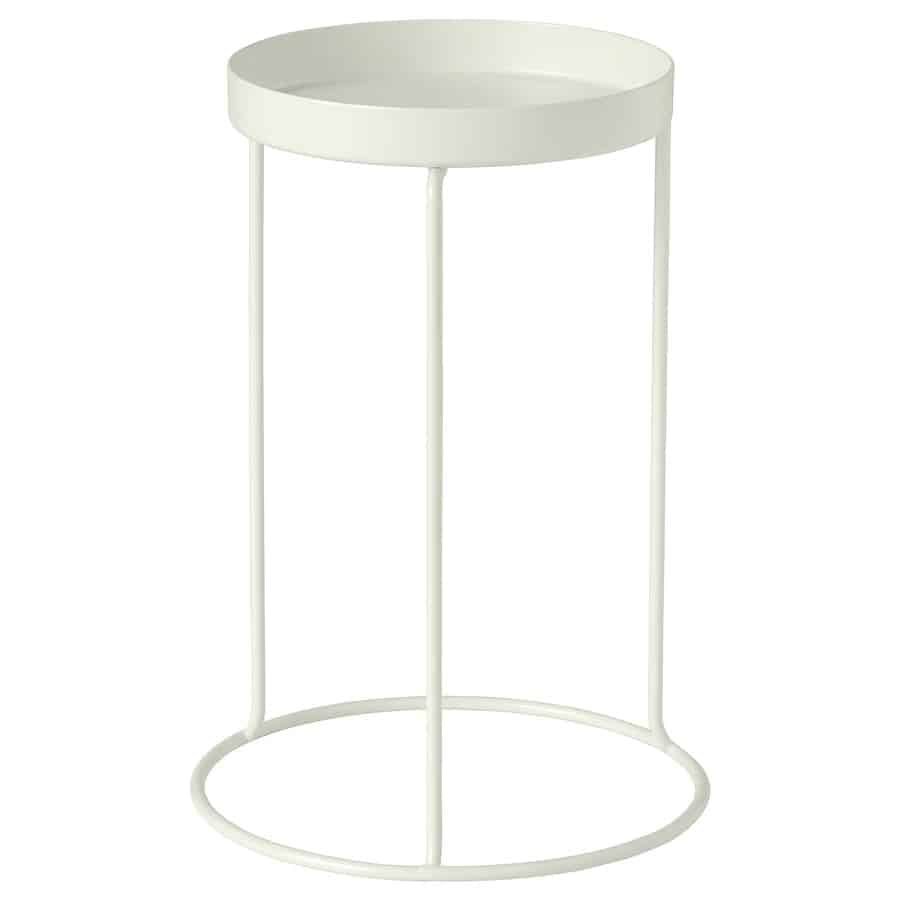 White metal plant stand with a round, shallow top and a circular ring base on three slender legs.