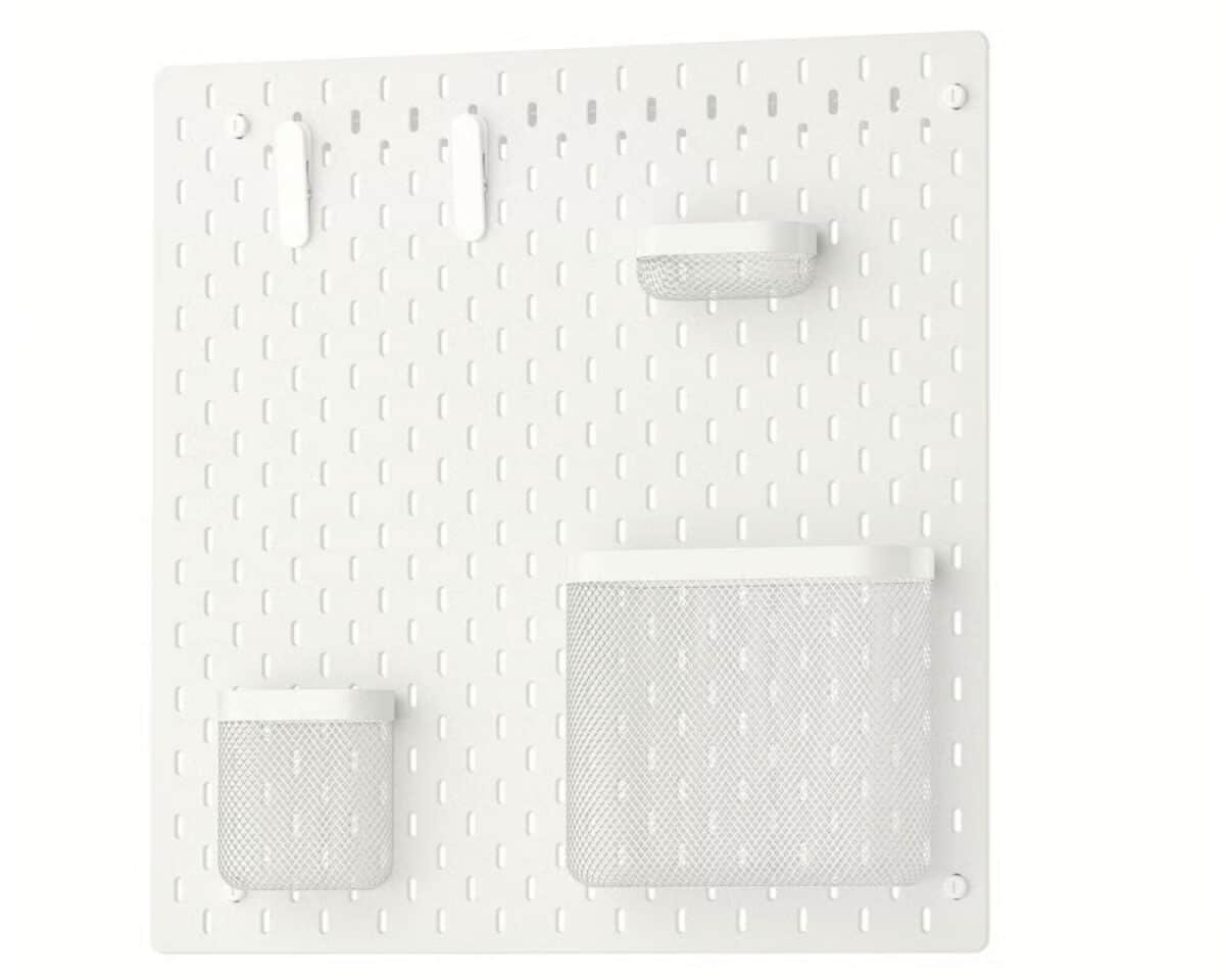 1 - IKEA Hackers White wall pegboard organizer with two mesh pockets and two hooks for storage items