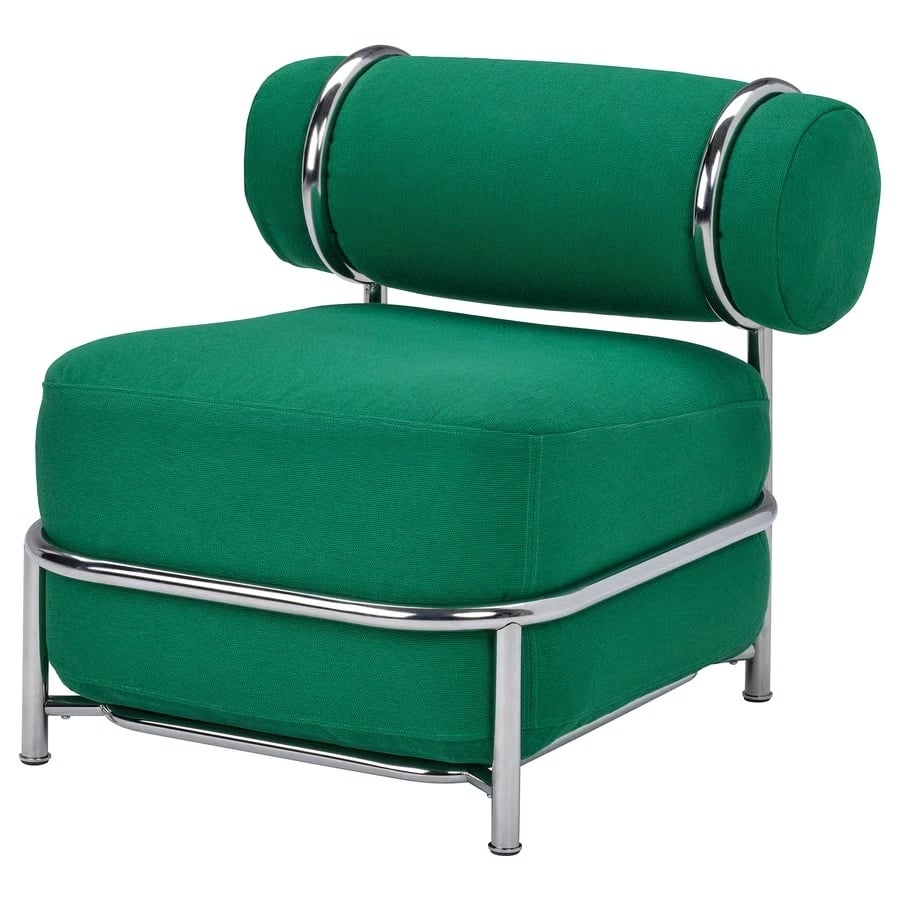 Green upholstered lounge chair with a tubular chrome frame and cylindrical back cushion.