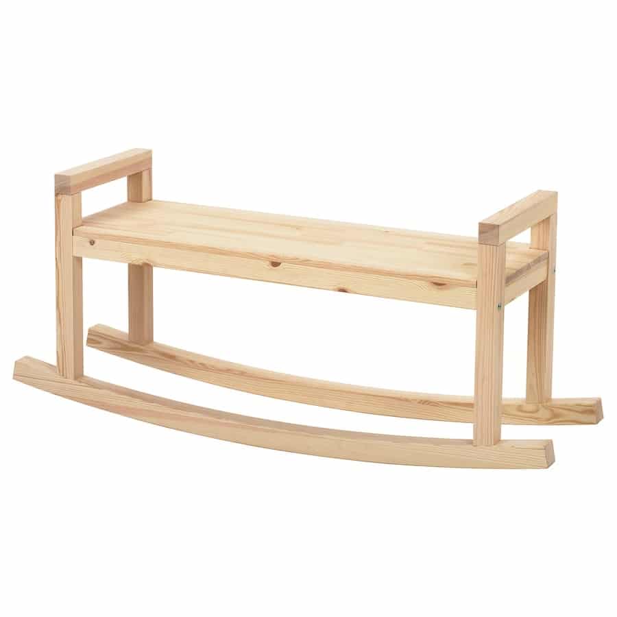 Unfinished wooden rocking chair frame in light pine on a white background