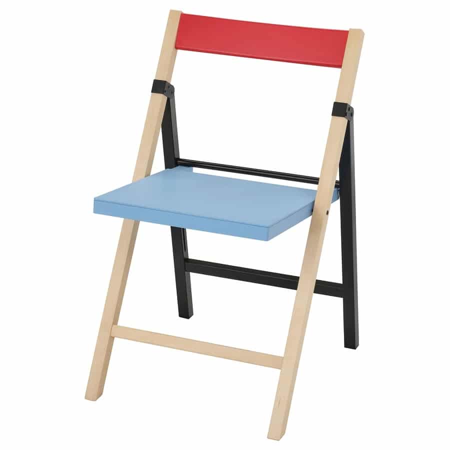 Small folding wooden chair for kids with a blue seat and red backrest, natural wood legs, and black supporting bars