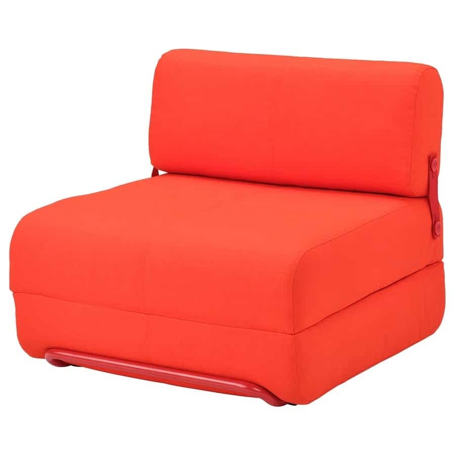 Bright red upholstered lounge chair with thick cushions and a curved base on a white background
