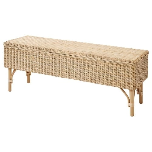8 - IKEA Hackers Long beige wicker outdoor bench with woven surface and light wooden legs.