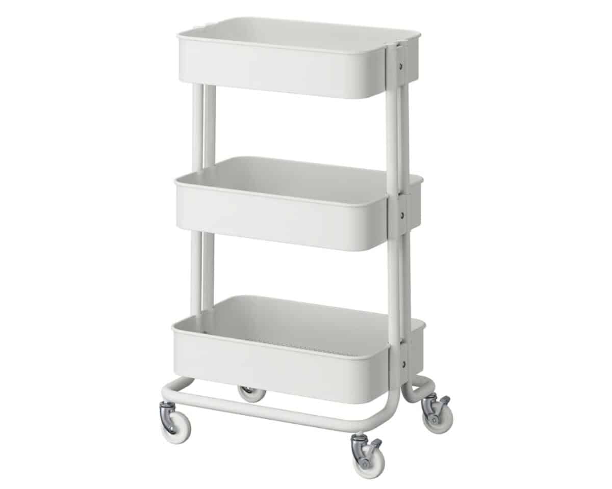 White three-tier rolling cart with built-in wheels and vertical supports, used for storage or organization.