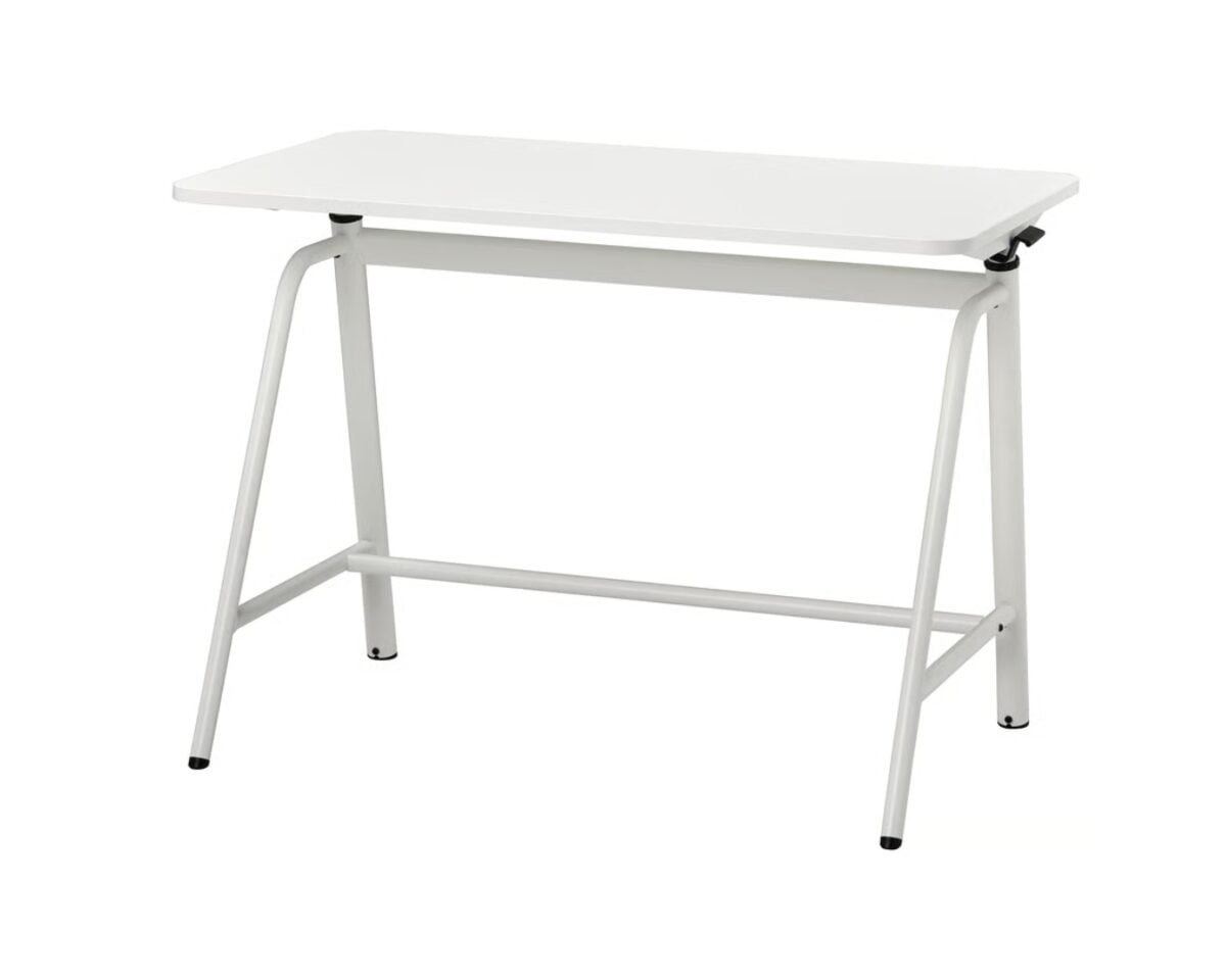White rectangular desk with metal A-frame legs and a small side lever for adjustment; simple student/work desk on wheels-free feet