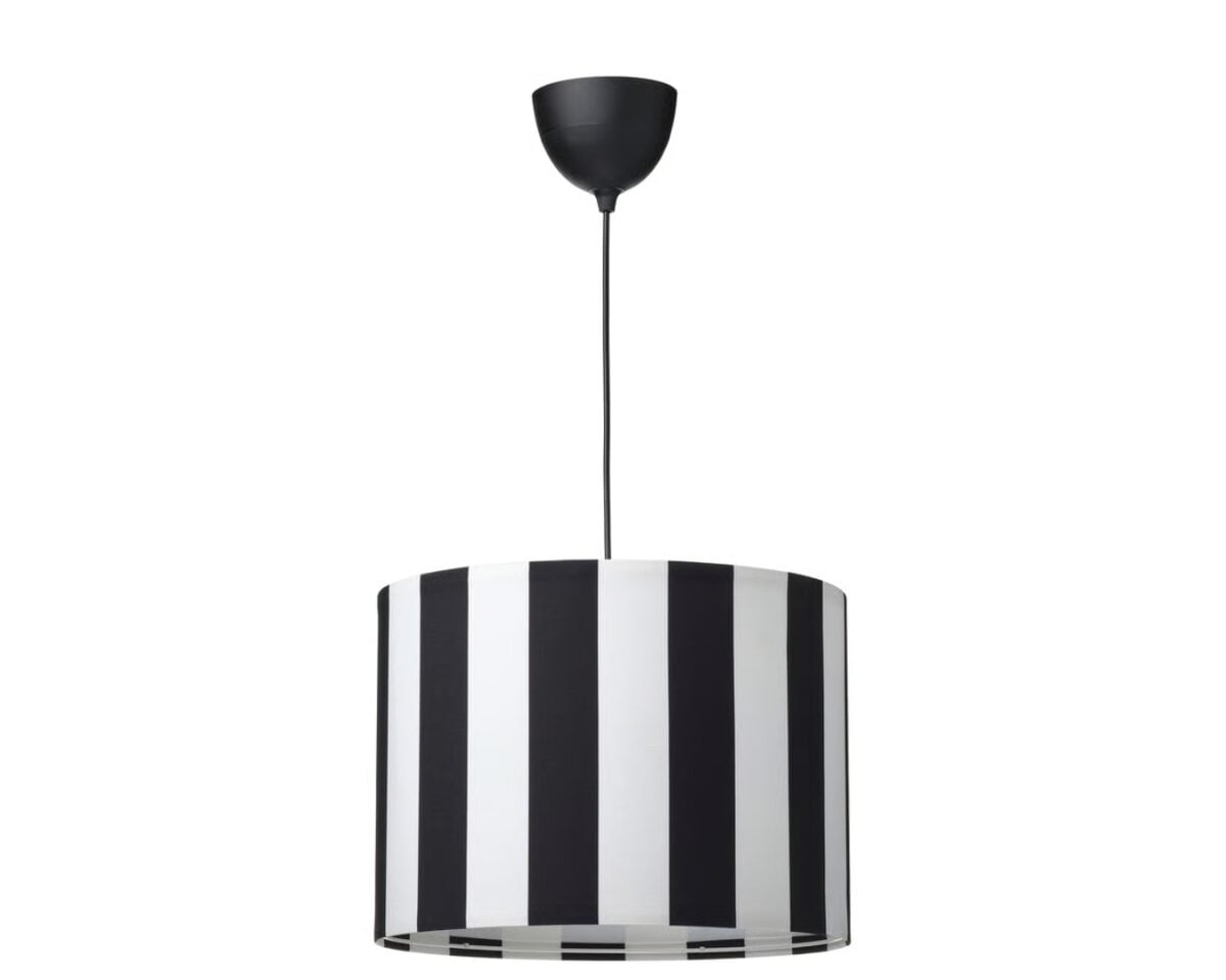 Pendant lamp with a black-and-white striped drum shade hanging from a black cord.