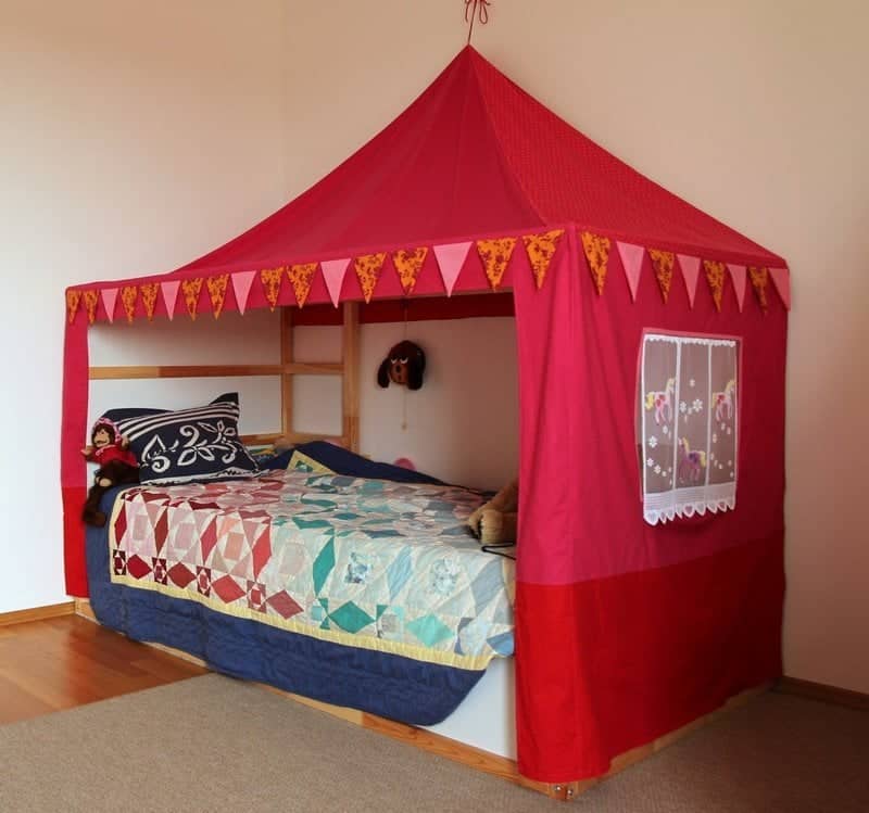 img_4656_zpsbagcaqmb - IKEA Hackers Red canopy bed tent in a child's room with a patchwork quilt and stuffed animals on the bed.
