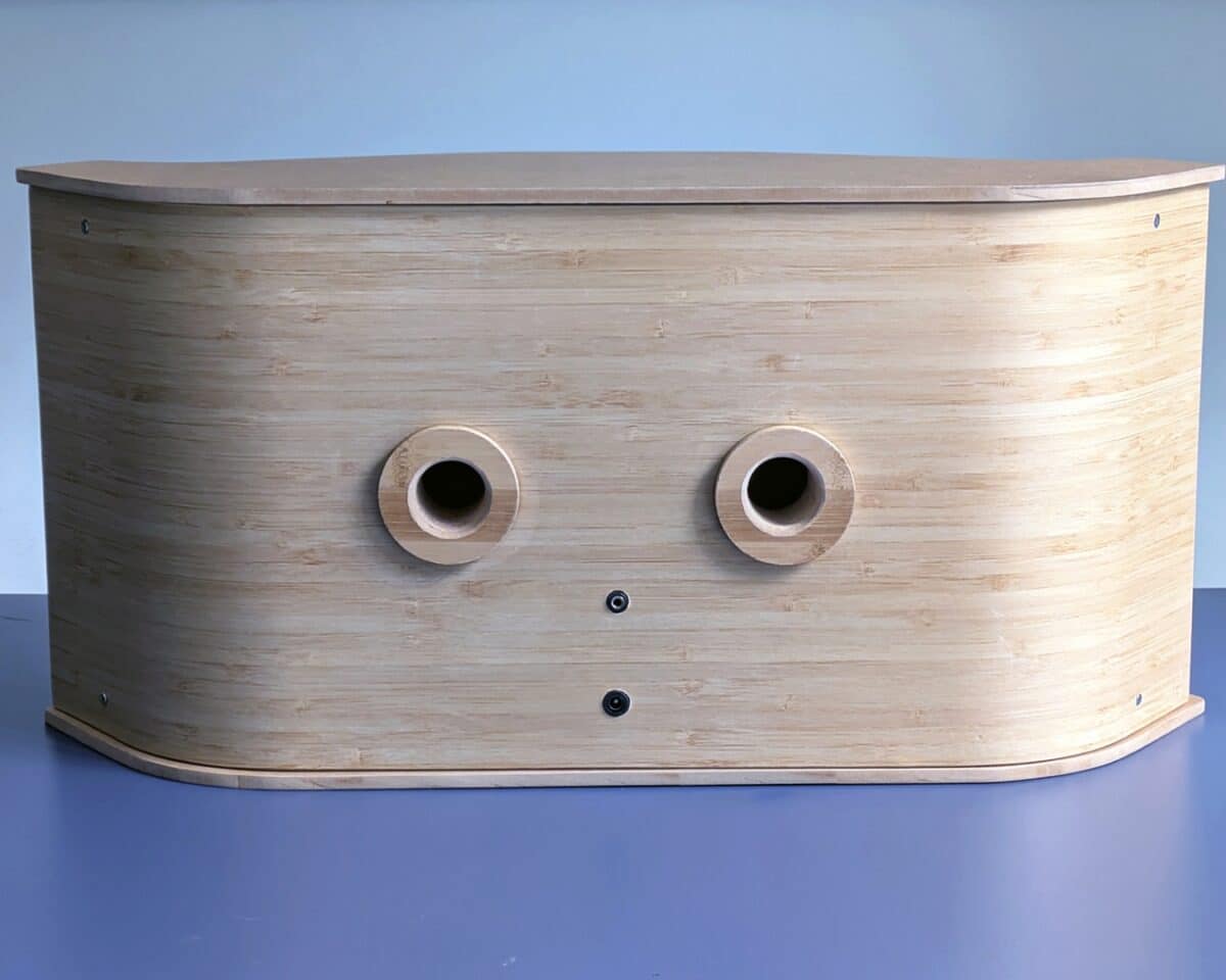 12 - IKEA Hackers Curved light-wood cabinet with two round holes on the front panel.