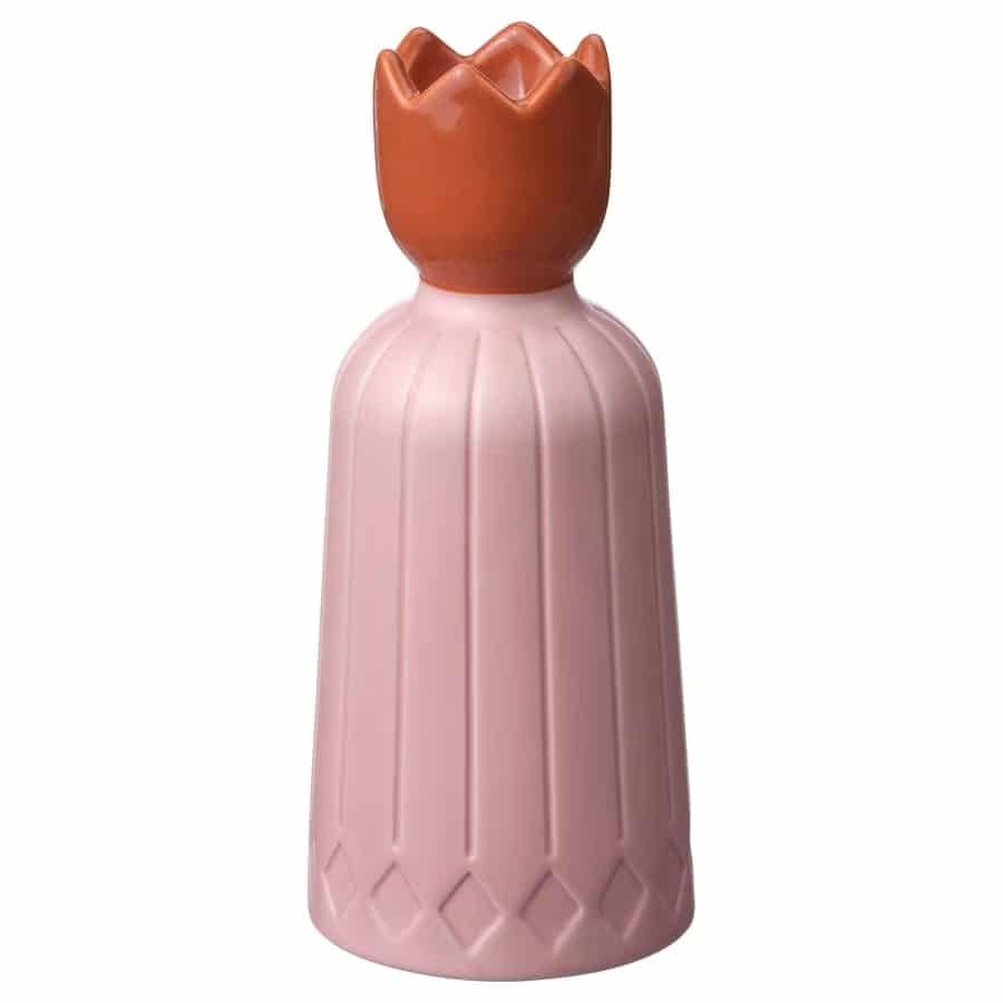 Pink ceramic vase with a ribbed body and a brown crown-shaped top.