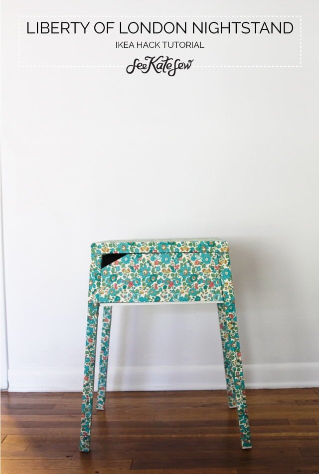 Floral turquoise stool covered in Liberty of London fabric, used as an IKEA hack nightstand in a bright minimal room.