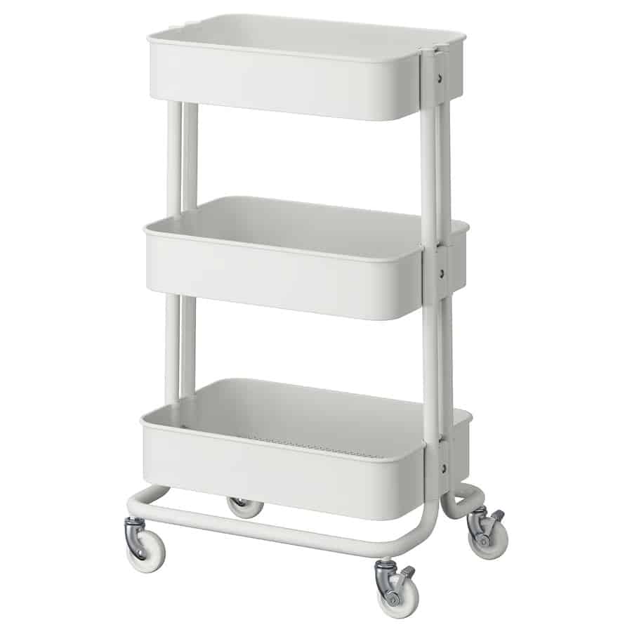 13 - IKEA Hackers RÅSKOG Utility Cart - Three-tier white metal rolling cart with a tubular frame and four caster wheels used for storage and transport