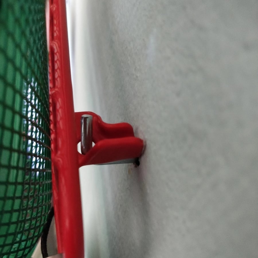 IKEA GREJIG shoe rack hack close up of hook holding the grid shelf in place