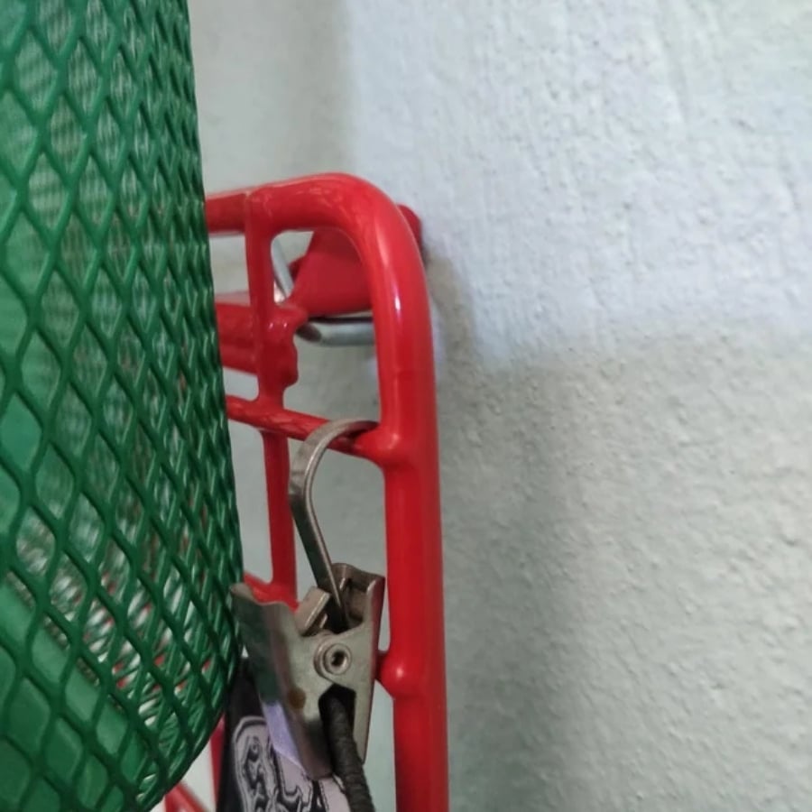 IKEA GREJIG shoe rack hack close up of hook holding the grid shelf in place