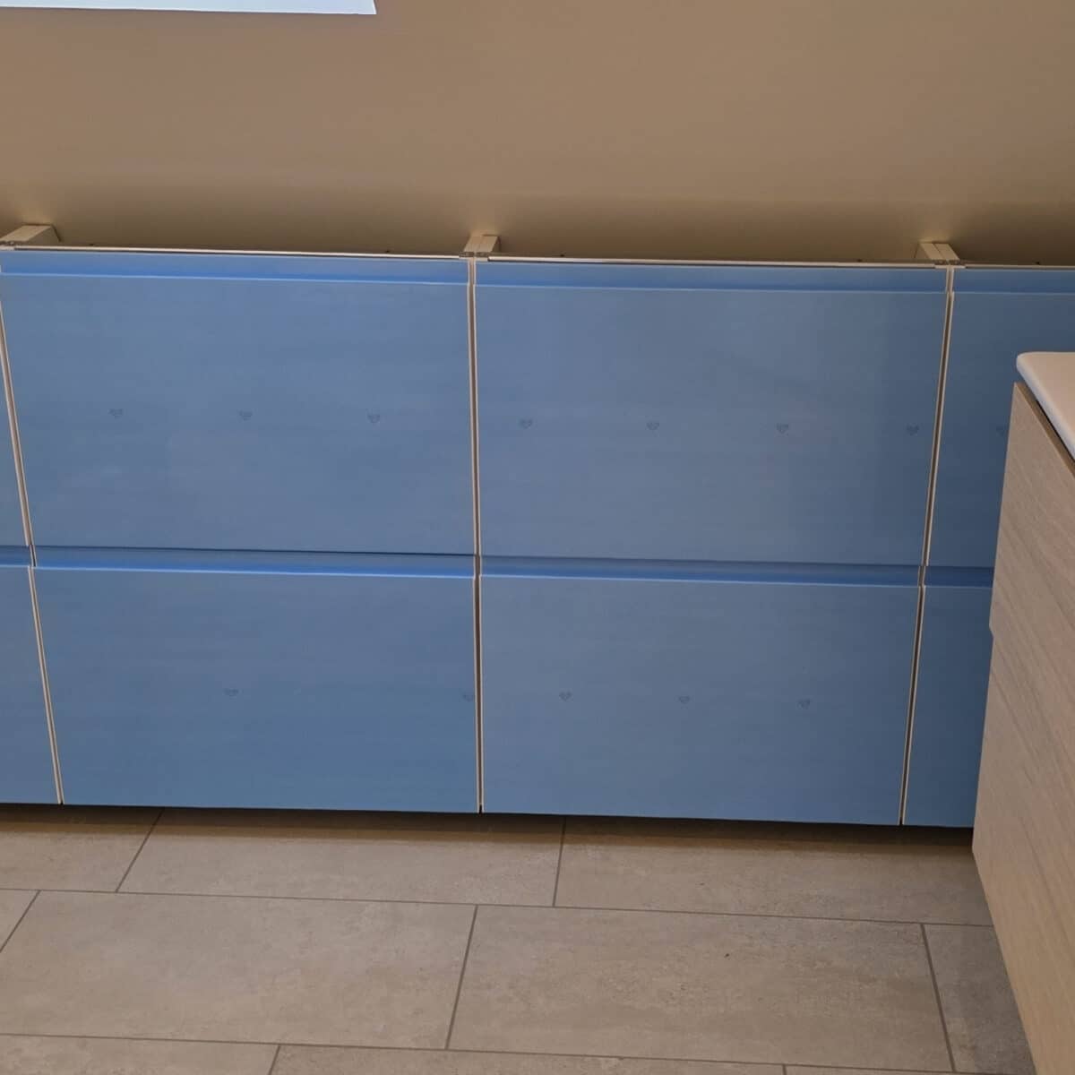 Adding IKEA Kitchen drawers to storage cabinets under sloped ceiling