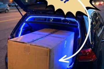 Oversized packaged protruding out of car trunk