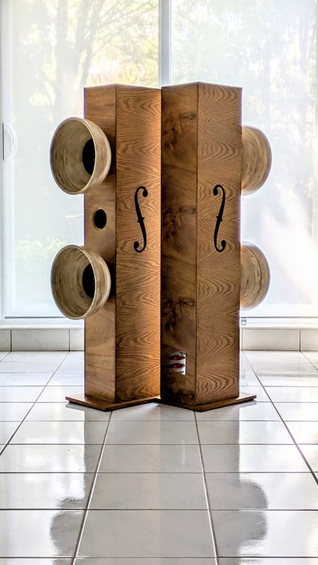 blanda bowl speakers - IKEA Hackers Two tall wooden columns with large round bowls attached to the sides, forming an artistic speaker-like sculpture in a bright room.